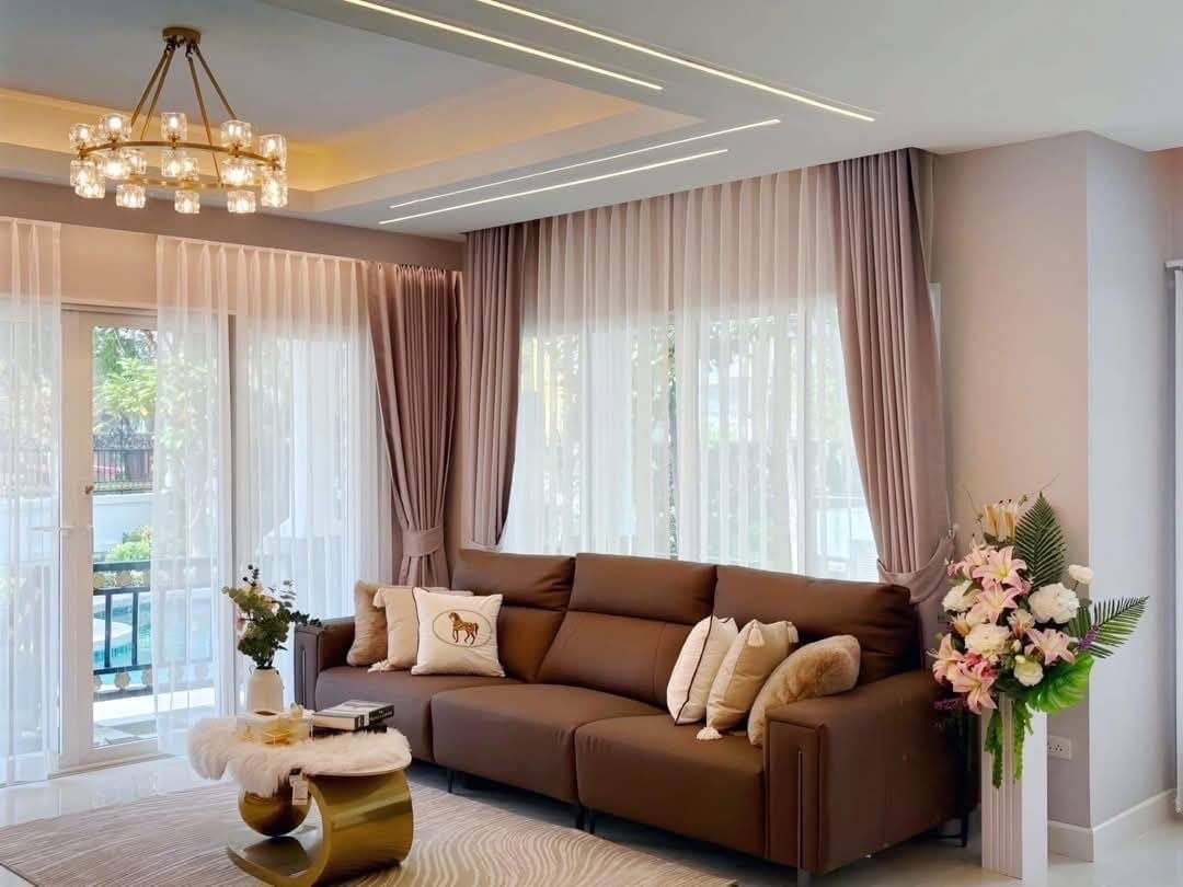 Pool Villa Central Park 4-2 (7) Modern luxury living room with brown sectional sofa and elegant interior design